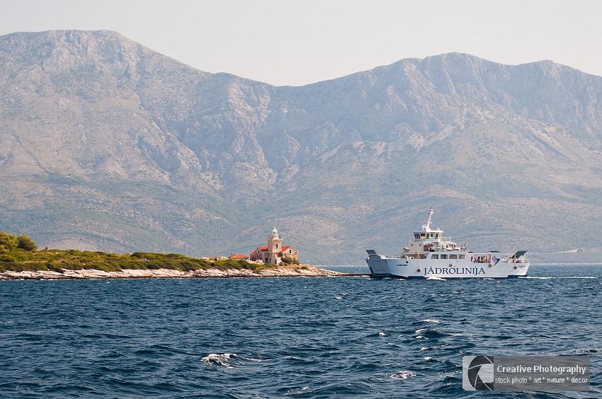 Big ship of Jadrolinija near the lighthouse of Sucuraj in Croatia