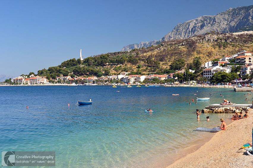 Beautiful beach of Podgora in Croatia with mountain Biokovo in background