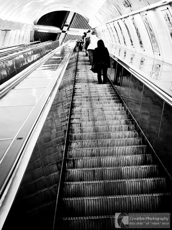 People on the escalator. Black and white photo